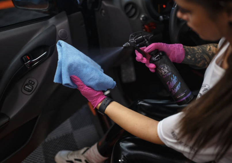 Inside Cleaner Boy – Person wearing pink gloves using blue microfibre cloth to detail car interior door panel | Car Interior | miio Store